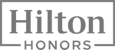 The image shows the Hilton Honors logo, featuring the text "Hilton Honors" enclosed in a rectangular border.