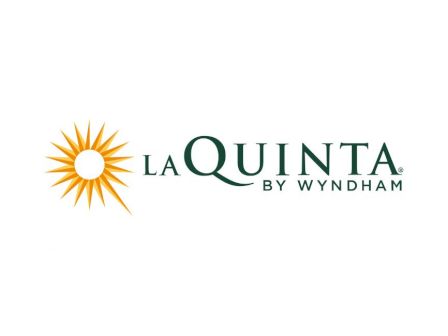 The image shows the logo of La Quinta by Wyndham, featuring a stylized sunburst next to the brand name text.